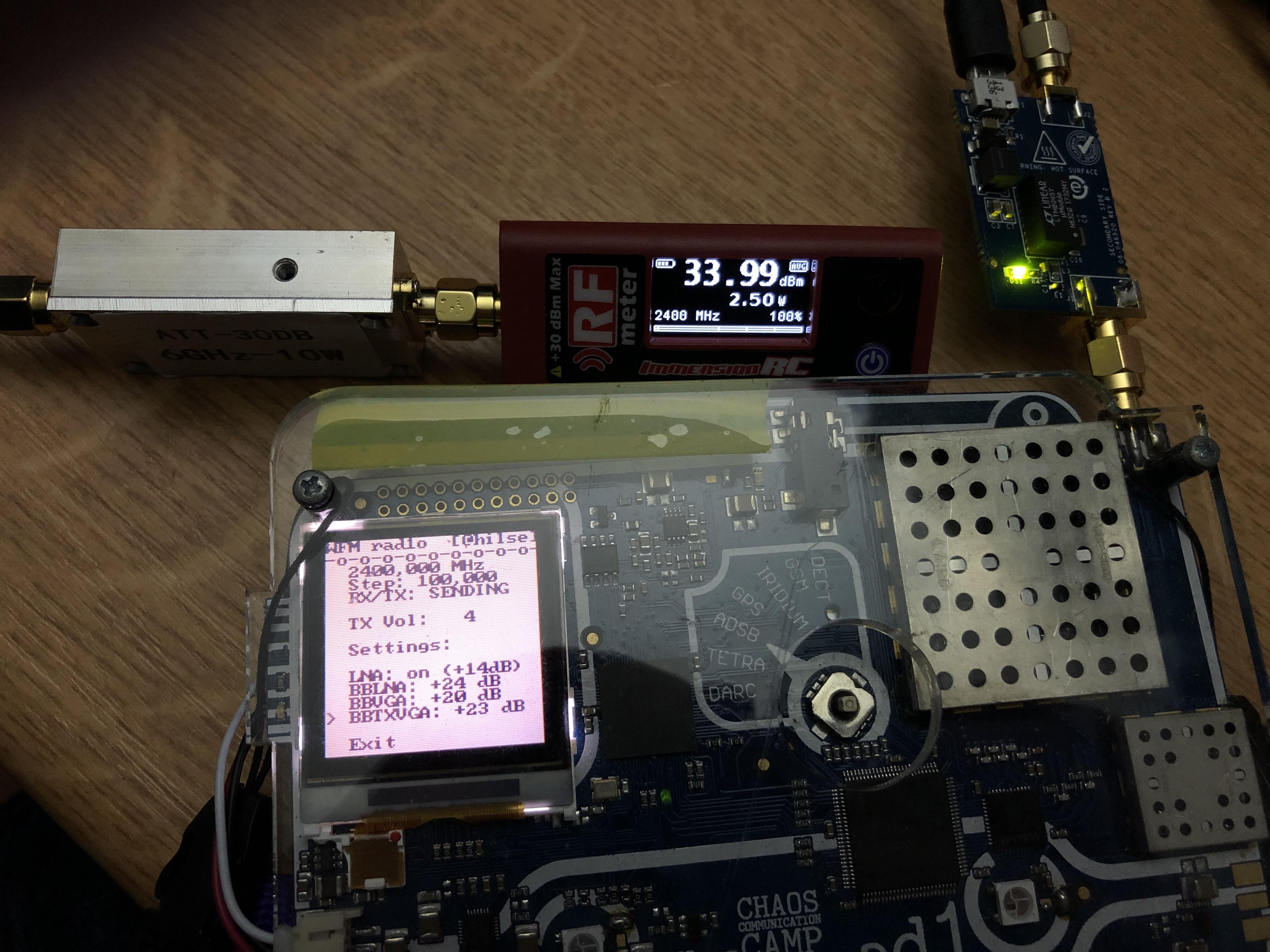 rad1o providing a test signal, power meter (connected to an attenuator) showing 33.99 dBm, 2.50W