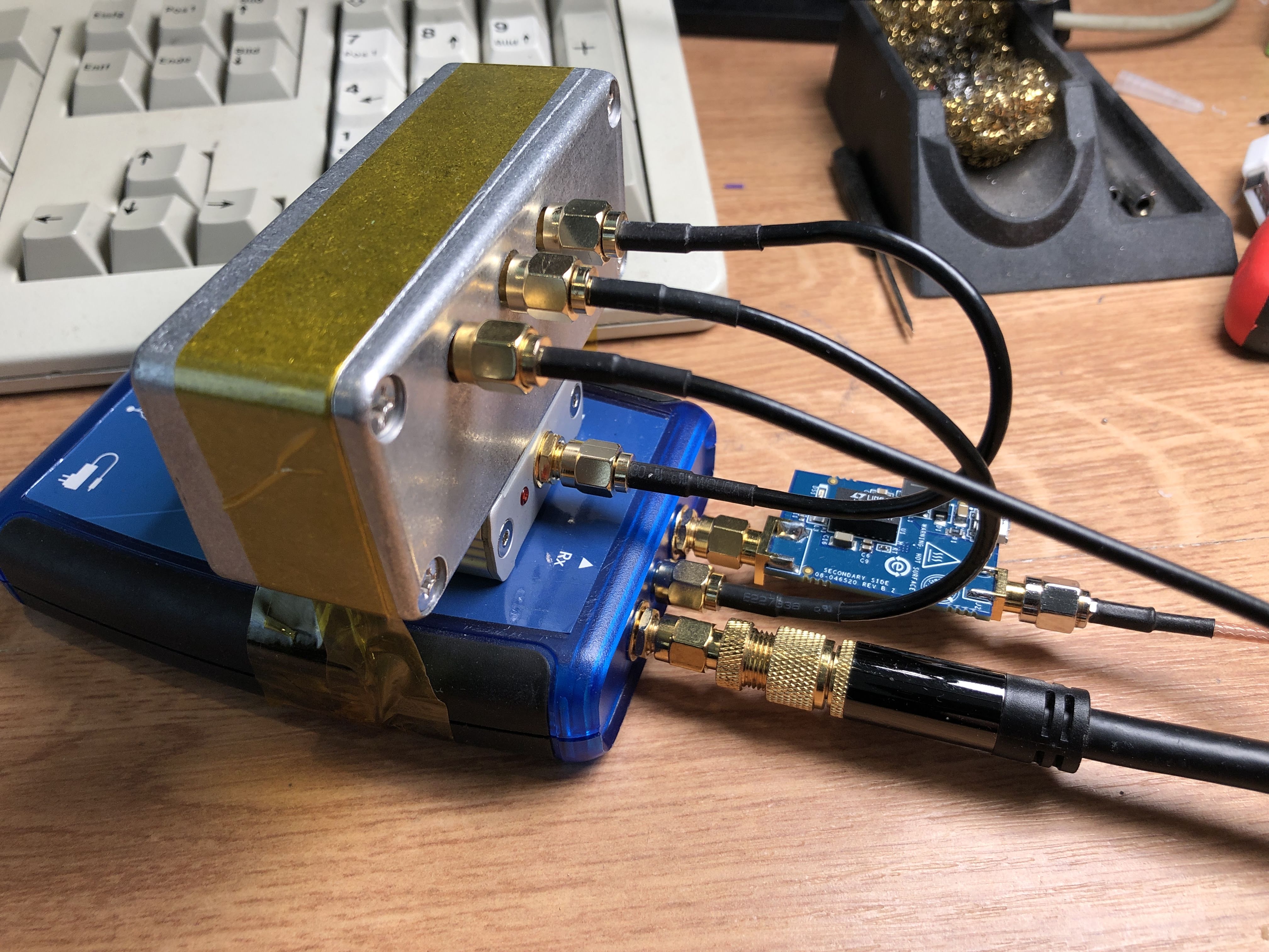 PlutoSDR with metal clock distribution box on top