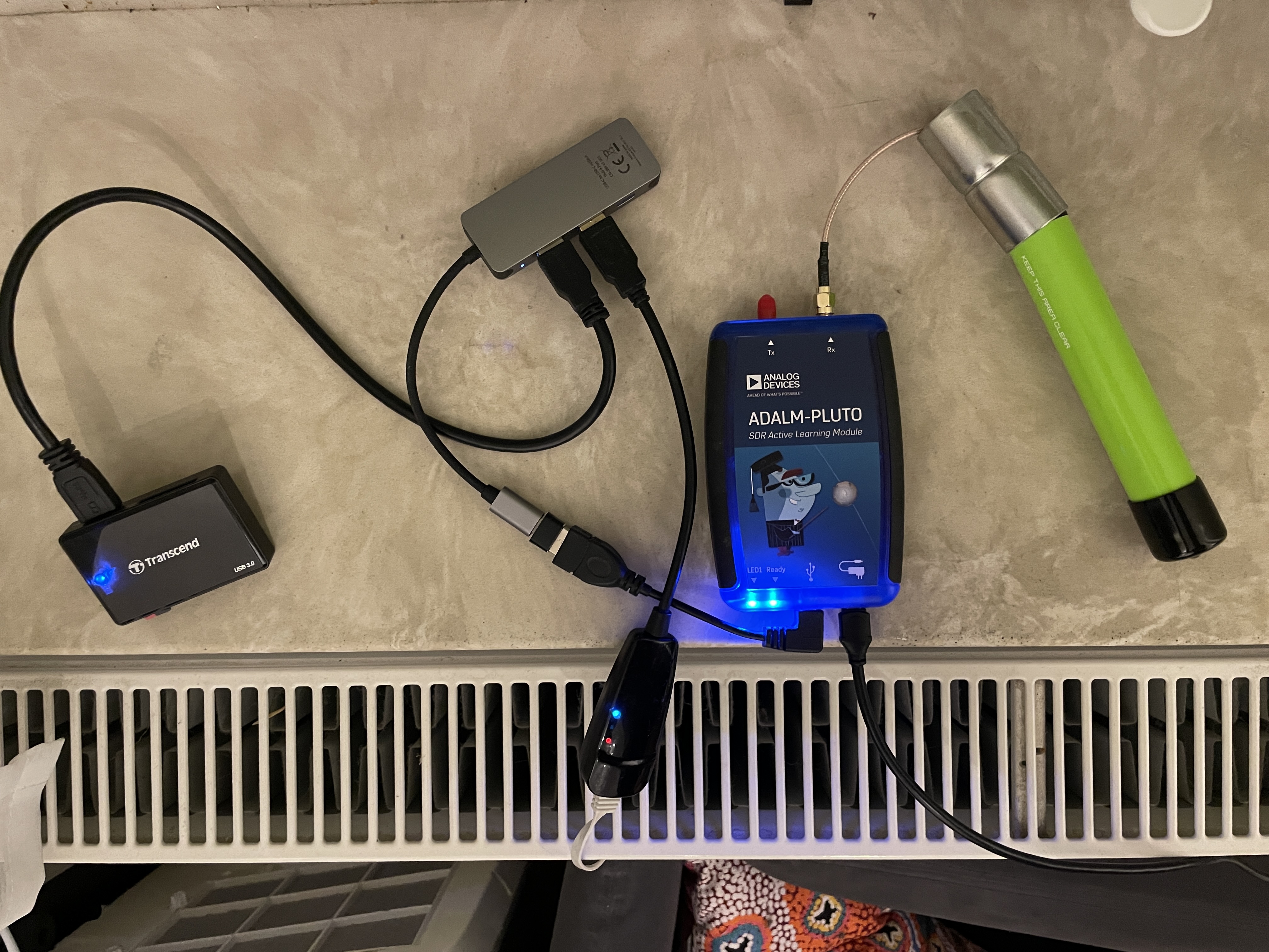 Setup on a windowsill, PlutoSDR with external ADSB antenna, USB-OTG adapter to USB-C hub, USB card reader and USB ethernet adapter
